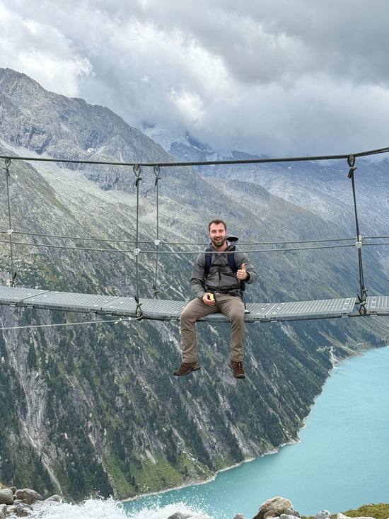 Suspension Bridge Snack by an Alpine Lake